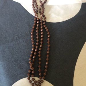 Long brown beaded necklace